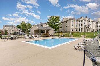Sparkling pool with sundeck and grill area